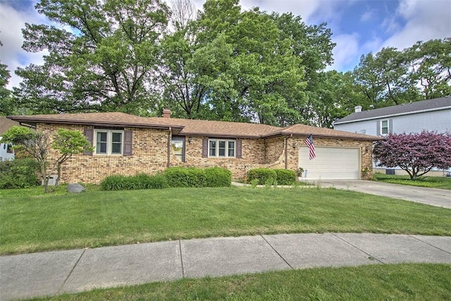 993 Cedar Hill Dr, Decatur, IL 62521 - single story home with an attached garage, brick siding, a front yard, and driveway