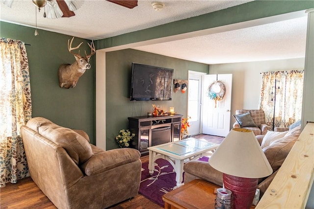 1741 Murray Clark Rd, Danville, IL 61832 - living area with a textured ceiling, wood finished floors, and a ceiling fan