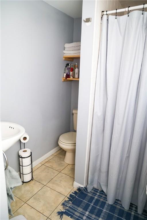 1741 Murray Clark Rd, Danville, IL 61832 - full bath with tile patterned flooring, a shower with shower curtain, toilet, and baseboards