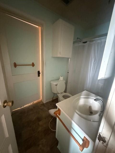 719 E Jefferson Ave, Chrisman, IL 61924 - bathroom featuring vanity and toilet