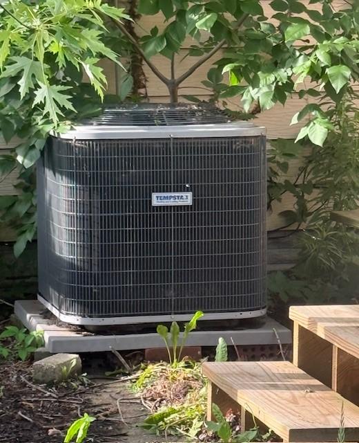 719 E Jefferson Ave, Chrisman, IL 61924 - exterior view of a central AC unit