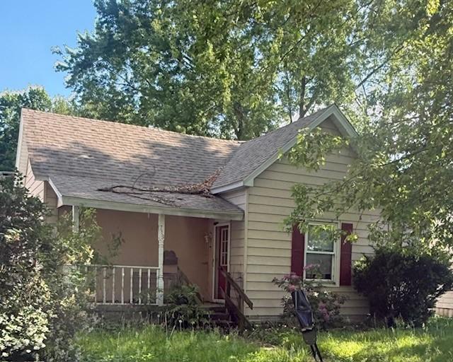 719 E Jefferson Ave, Chrisman, IL 61924 - view of front facade with roof with shingles