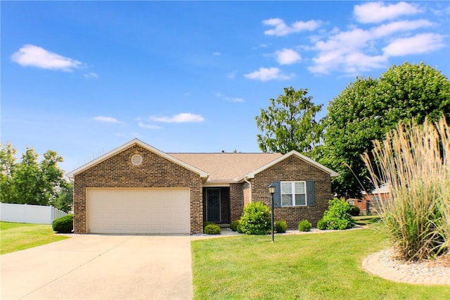 11 Copperfield Ln, Charleston, IL 61920 - view of front facade with a garage, driveway, and brick siding