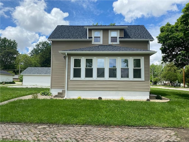 101 S Sheridan St, Pana, IL 62557 - view of side of property with a yard and a shingled roof