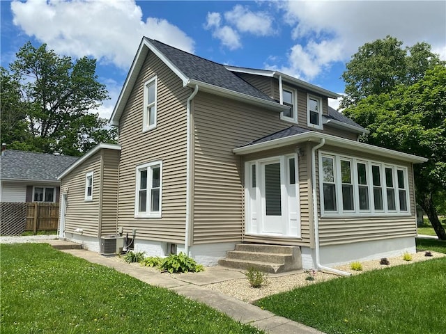 101 S Sheridan St, Pana, IL 62557 - rear view of house featuring entry steps, central AC unit, and roof with shingles