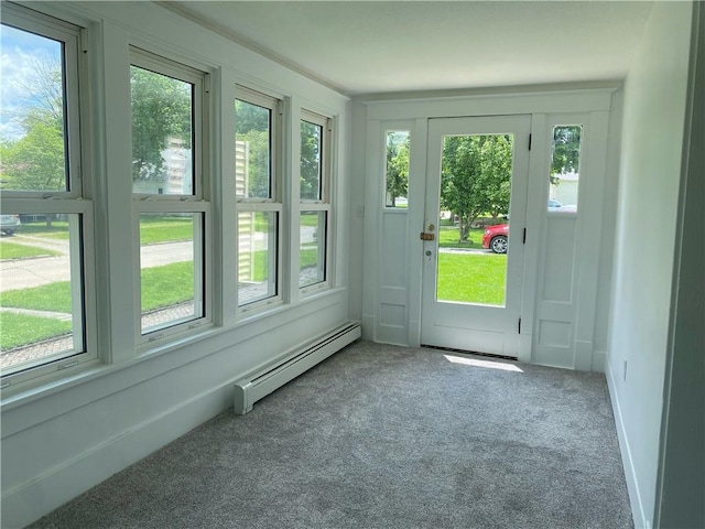 101 S Sheridan St, Pana, IL 62557 - doorway featuring a baseboard heating unit, carpet, and plenty of natural light