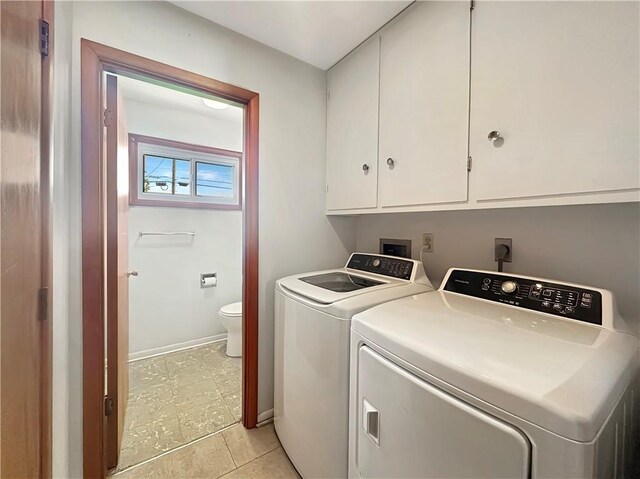 723 Kenton Dr, Charleston, IL 61920 - washroom featuring washing machine and dryer and cabinet space