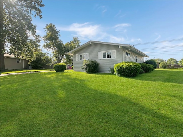 723 Kenton Dr, Charleston, IL 61920 - view of home's exterior featuring a yard