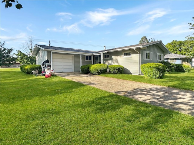 723 Kenton Dr, Charleston, IL 61920 - single story home with driveway, an attached garage, and a front lawn