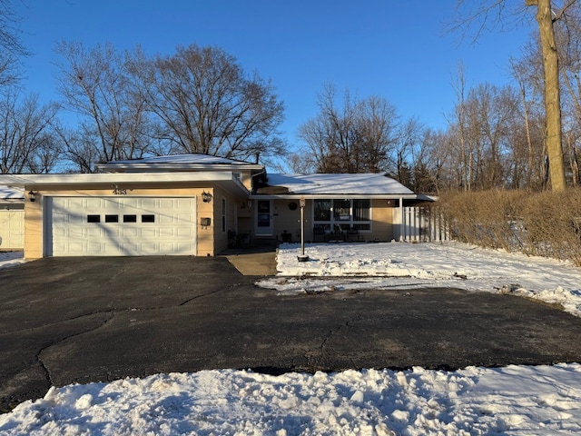 view of front of house with covered porch and a garage