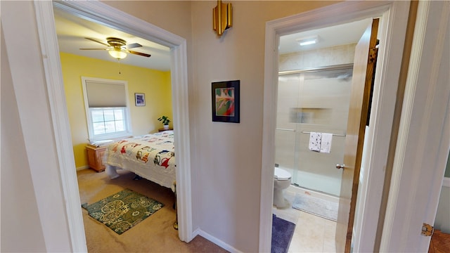 bedroom featuring ceiling fan and baseboards