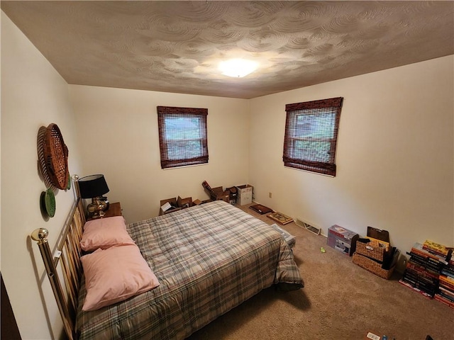 1101 Robinwood Dr, Robinson, IL 62454 - carpeted bedroom featuring a textured ceiling