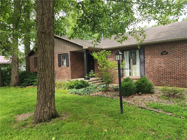 1101 Robinwood Dr, Robinson, IL 62454 - ranch-style home with brick siding and a front lawn