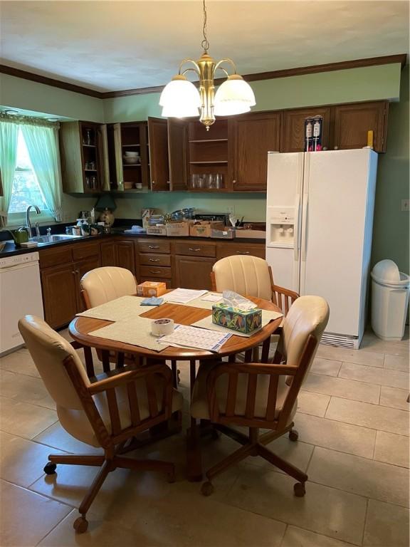 1101 Robinwood Dr, Robinson, IL 62454 - kitchen with white appliances, open shelves, dark countertops, light tile patterned floors, and crown molding