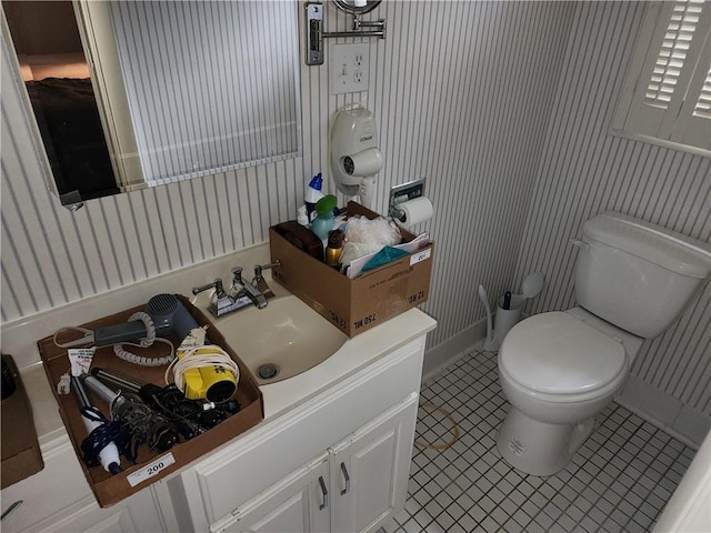 1101 Robinwood Dr, Robinson, IL 62454 - half bathroom with wallpapered walls, vanity, and tile patterned floors