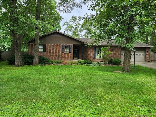 1101 Robinwood Dr, Robinson, IL 62454 - ranch-style home featuring a garage, brick siding, and driveway