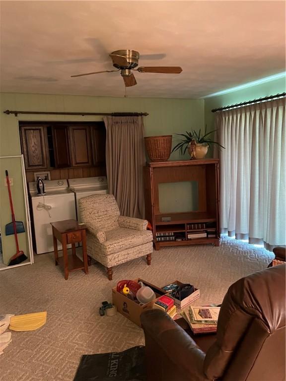 1101 Robinwood Dr, Robinson, IL 62454 - living room with a ceiling fan, separate washer and dryer, and carpet flooring