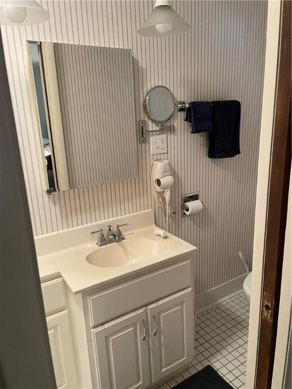 1101 Robinwood Dr, Robinson, IL 62454 - half bath with wallpapered walls, vanity, and tile patterned floors