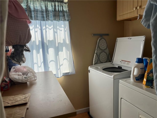 1215 Westside Dr, Mt Zion, IL 62549 - washroom featuring healthy amount of natural light, washing machine and dryer, and cabinet space
