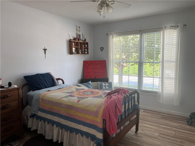 1215 Westside Dr, Mt Zion, IL 62549 - bedroom with multiple windows, wood finished floors, and a ceiling fan