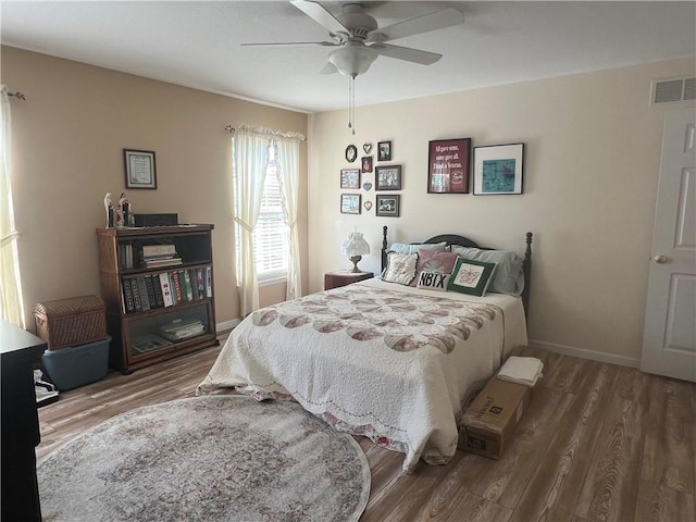 1215 Westside Dr, Mt Zion, IL 62549 - bedroom featuring wood finished floors and ceiling fan