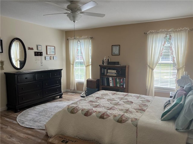 1215 Westside Dr, Mt Zion, IL 62549 - bedroom featuring wood finished floors and ceiling fan