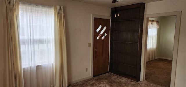 entryway featuring carpet flooring