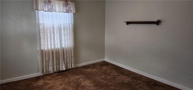 unfurnished room featuring carpet