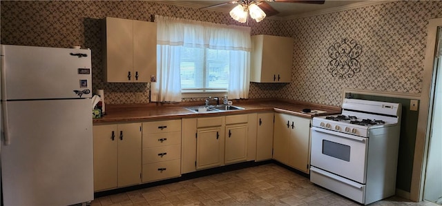 kitchen featuring ceiling fan, sink, white appliances, cream cabinetry, and ornamental molding