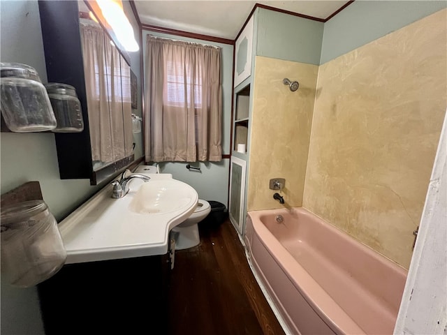 full bathroom featuring hardwood / wood-style flooring, toilet, crown molding, and sink