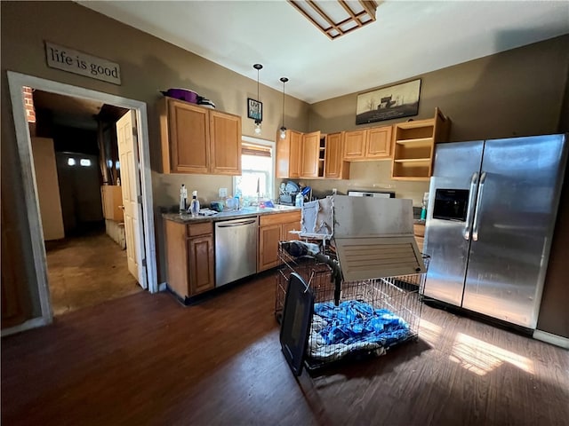 kitchen featuring pendant lighting, dark hardwood / wood-style flooring, stainless steel appliances, and light brown cabinetry