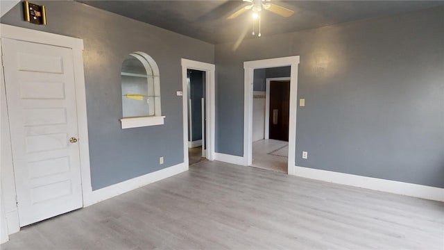 unfurnished bedroom featuring light hardwood / wood-style flooring and ceiling fan