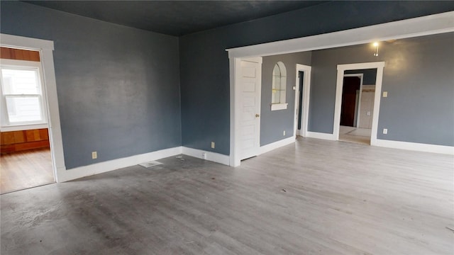 unfurnished room with hardwood / wood-style floors