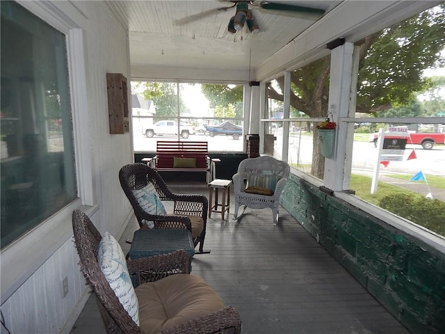 sunroom with ceiling fan and plenty of natural light