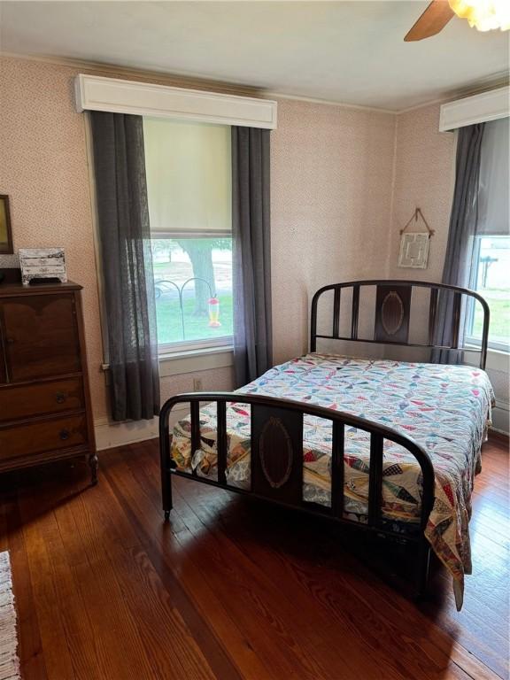 bedroom featuring hardwood / wood-style flooring and ceiling fan