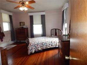 bedroom with hardwood / wood-style flooring