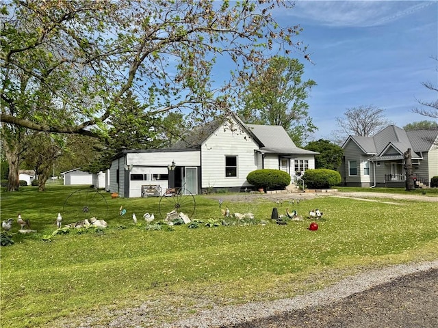 view of front of home with a front yard and a garage