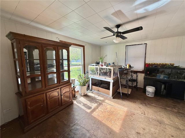 interior space with ceiling fan
