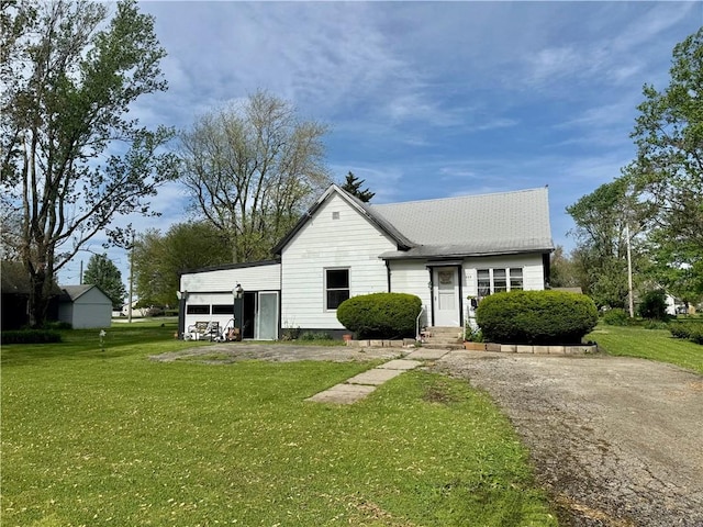 bungalow-style house with a front yard