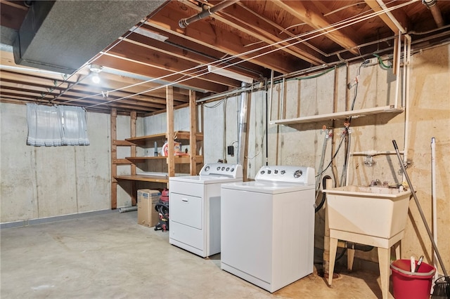 317 Holiday Dr, Decatur, IL 62526 - unfinished below grade area with washing machine and dryer and a sink