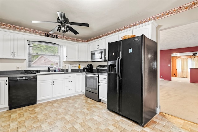317 Holiday Dr, Decatur, IL 62526 - kitchen featuring black appliances, dark countertops, white cabinetry, a ceiling fan, and a sink