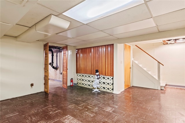 317 Holiday Dr, Decatur, IL 62526 - finished below grade area featuring tile patterned floors, stairway, and a paneled ceiling