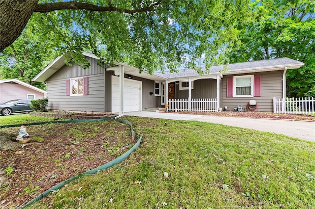 317 Holiday Dr, Decatur, IL 62526 - single story home with a porch, an attached garage, and driveway
