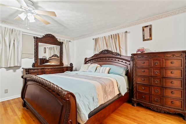 317 Holiday Dr, Decatur, IL 62526 - bedroom featuring light wood finished floors, baseboards, and a ceiling fan