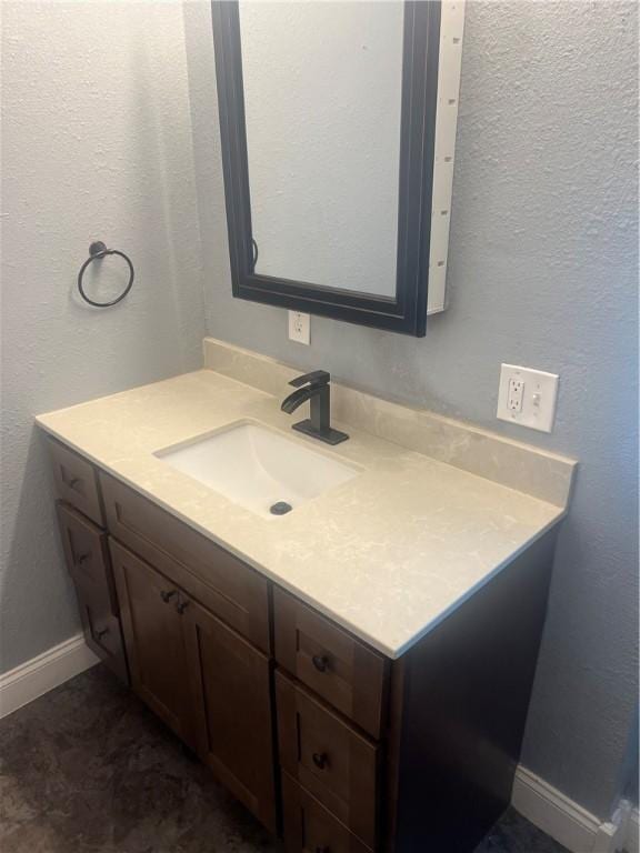 1005 Edgar Ave, Mattoon, IL 61938 - bathroom with vanity and baseboards