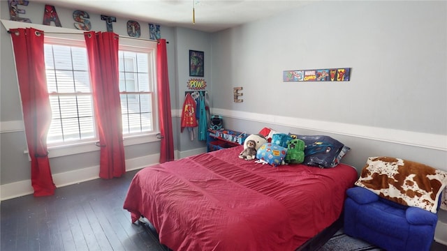 bedroom with dark wood-type flooring