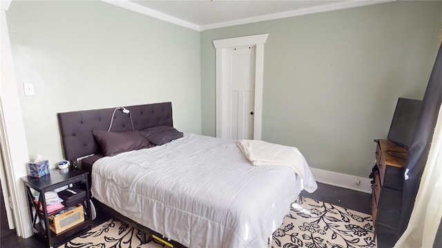 bedroom featuring crown molding