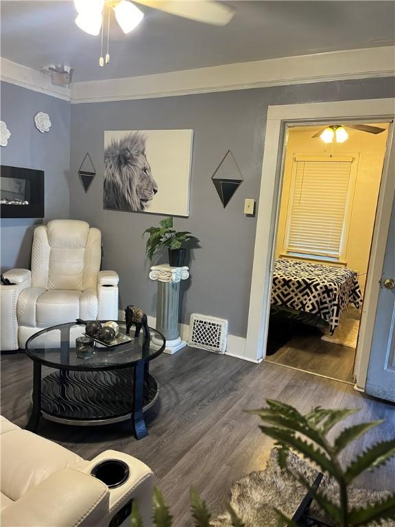 625 S Jackson St, Decatur, IL 62521 - living room featuring dark wood finished floors, baseboards, and ceiling fan