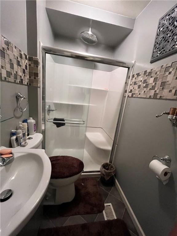 625 S Jackson St, Decatur, IL 62521 - full bathroom featuring tile patterned floors, a sink, toilet, a stall shower, and visible vents