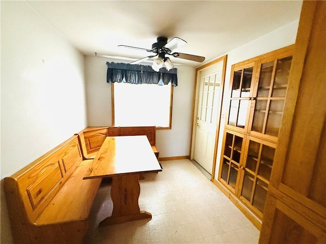 314 W Maple St, Hoopeston, IL 60942 - unfurnished dining area with a ceiling fan and light flooring